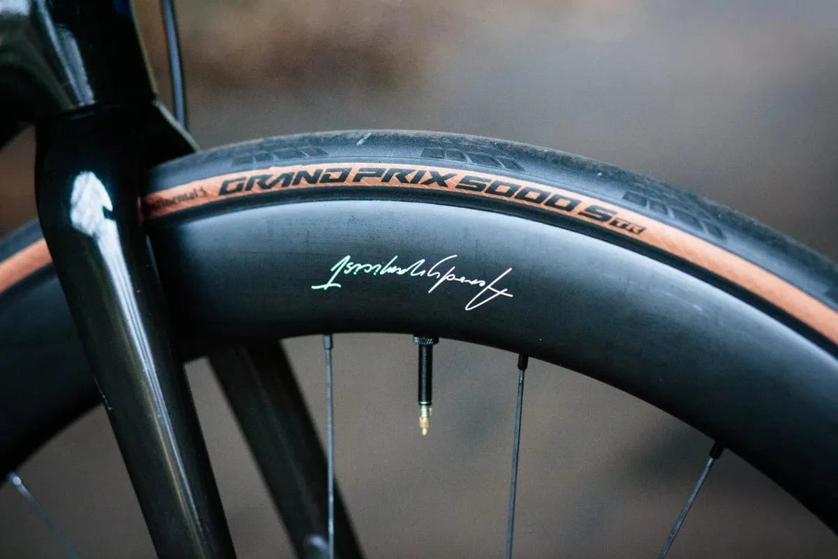 Close-up of Continental Grand Prix 5000 S TR road bike tire mounted on a black rim.