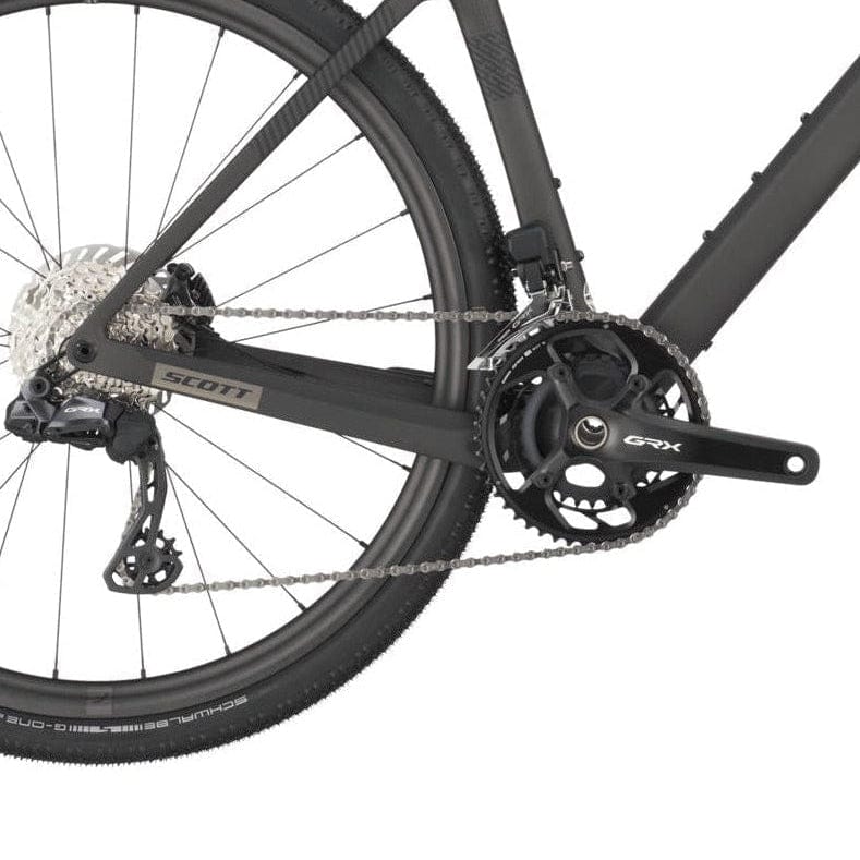 Close-up of a bicycle chain and gear system on a white background