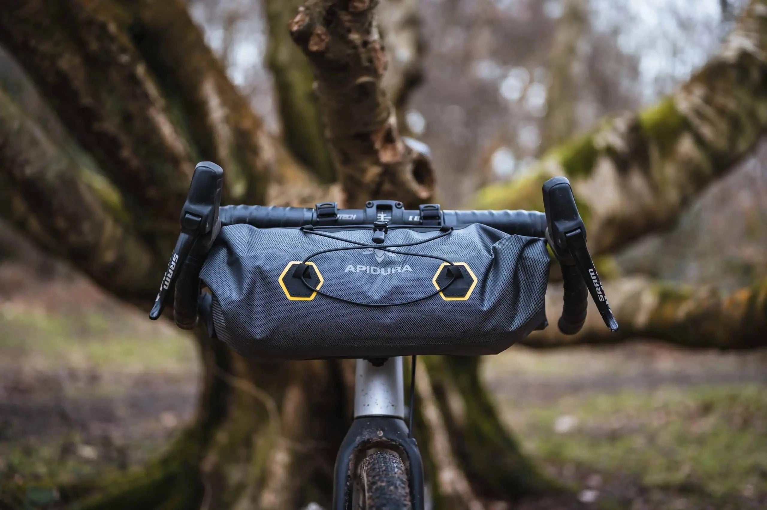 handlebar bag from Apidura installed on the front of a bike